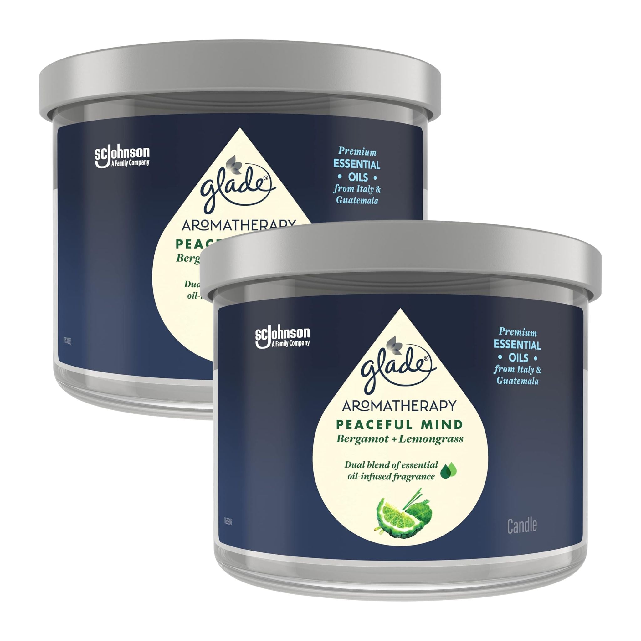 Two Glade Aromatherapy candles with blue labels on a white background