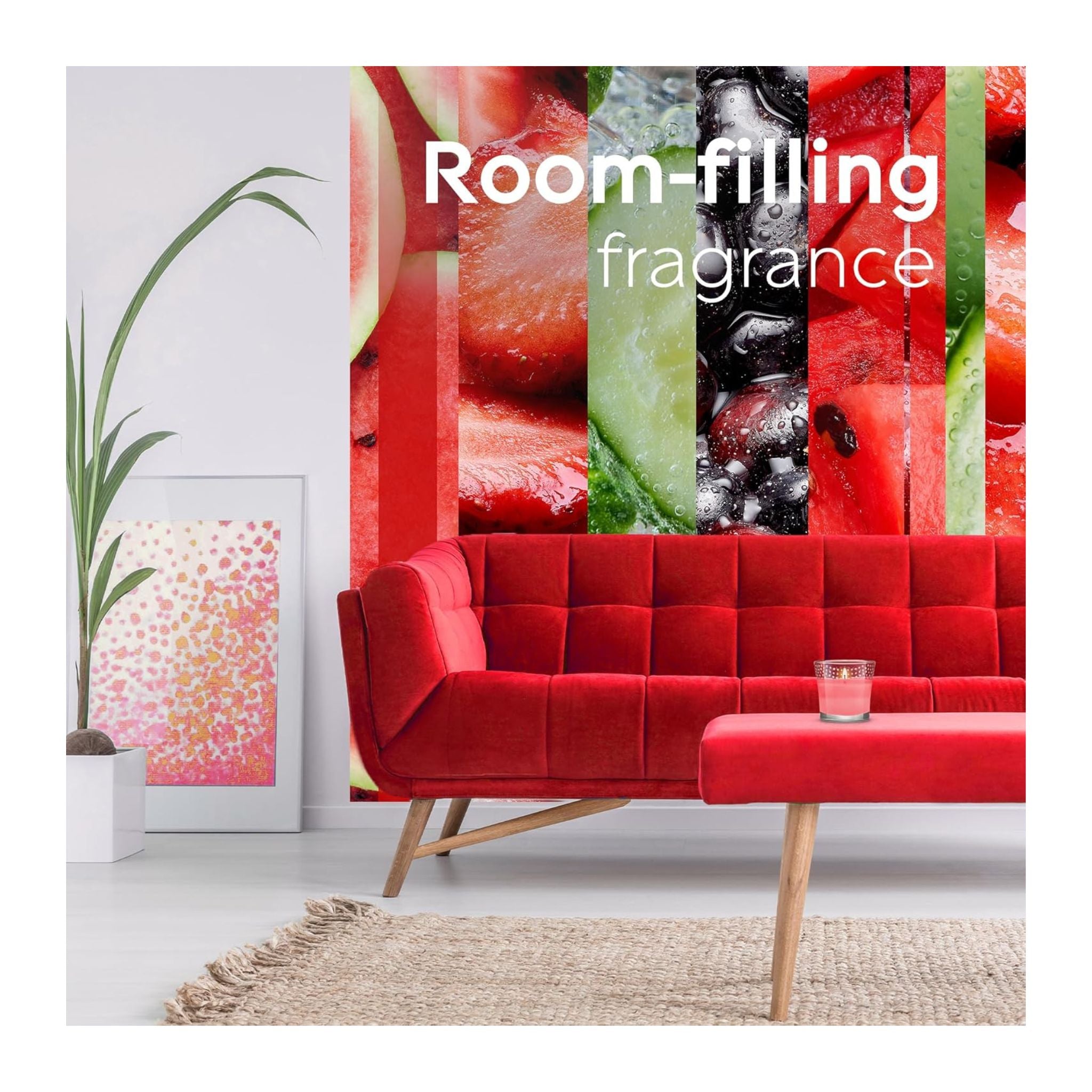 Red sofa in a room with a colorful abstract painting and a candle on a small table.