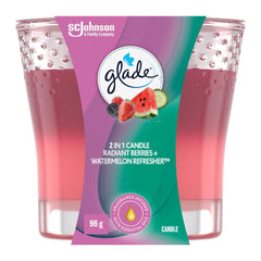 Glade candle packaging with berry and watermelon scents on a white background
