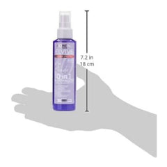 Elvive hair product bottle held by a hand with dimensions indicated