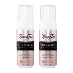 Two bottles of Loving Tan 2 HR Express Deluxe Bronzing Mousse on a white background
