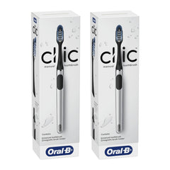 Two boxes of Oral-B Clic manual toothbrushes on a white background