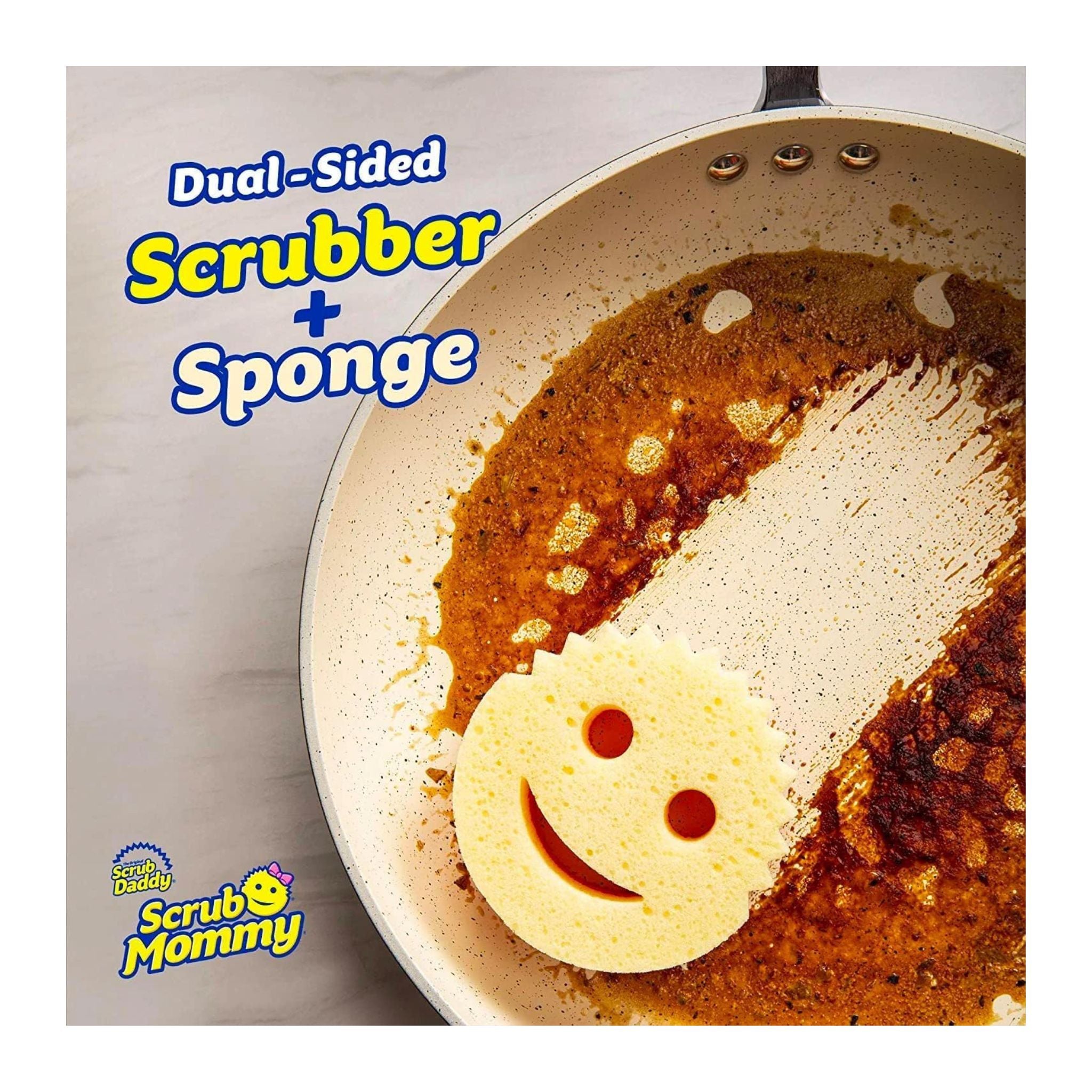 Scrub Daddy scrubber with smiley face design on a rusty pan, featuring the brand name 'Scrub Mommy'.