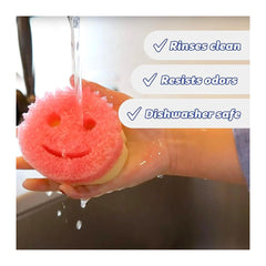 Pink smiley face sponge being rinsed under running water with text indicating its features.